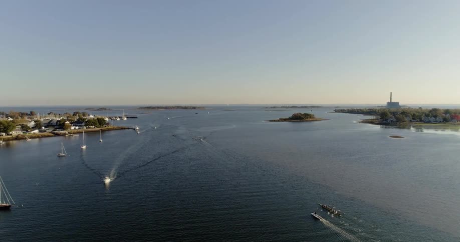 Boats moving across a lake