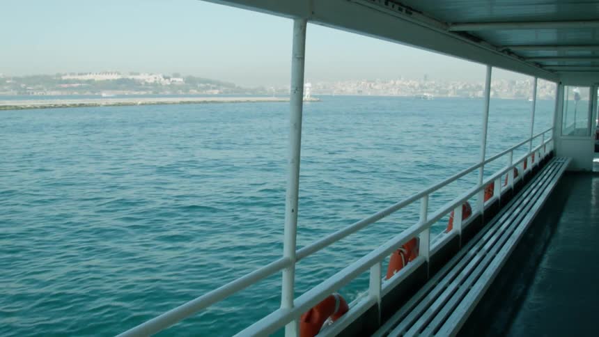 The ferry is traveling across the water