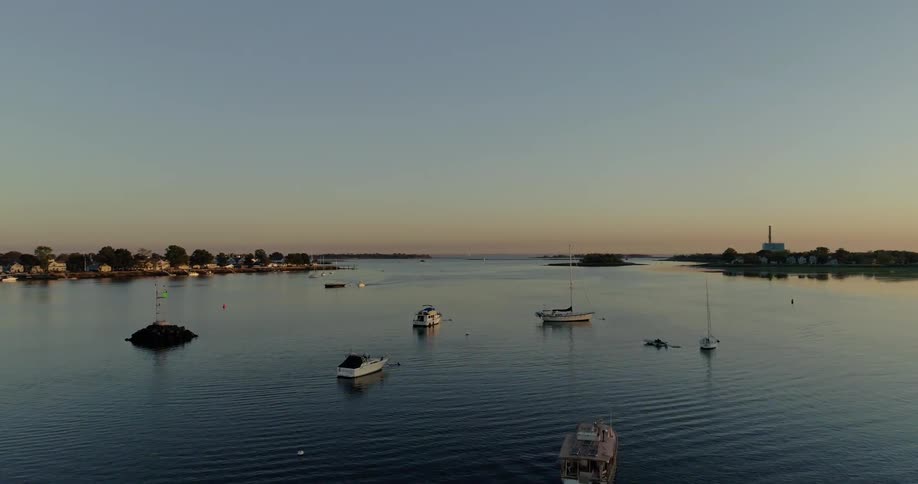 A drone is flying over a group of boats