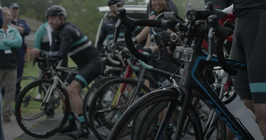 A group of bicyclists gather together