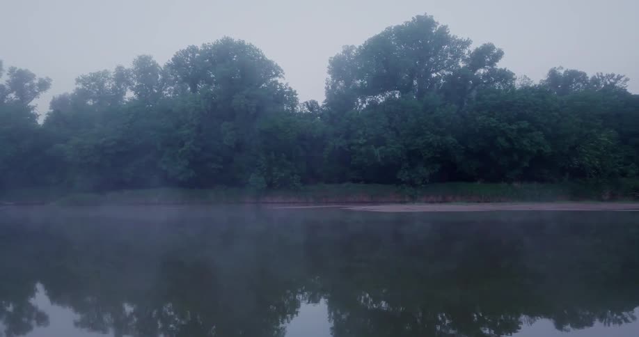 The lake has fog rolling over it