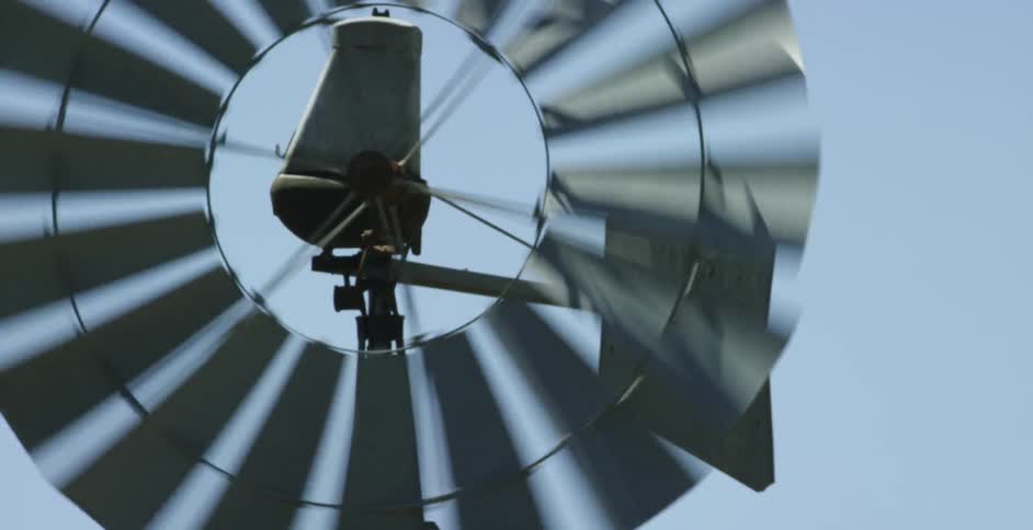 A windmill spins rapidly in the breeze