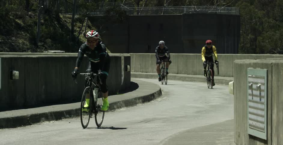 Bicyclists ride on the concrete