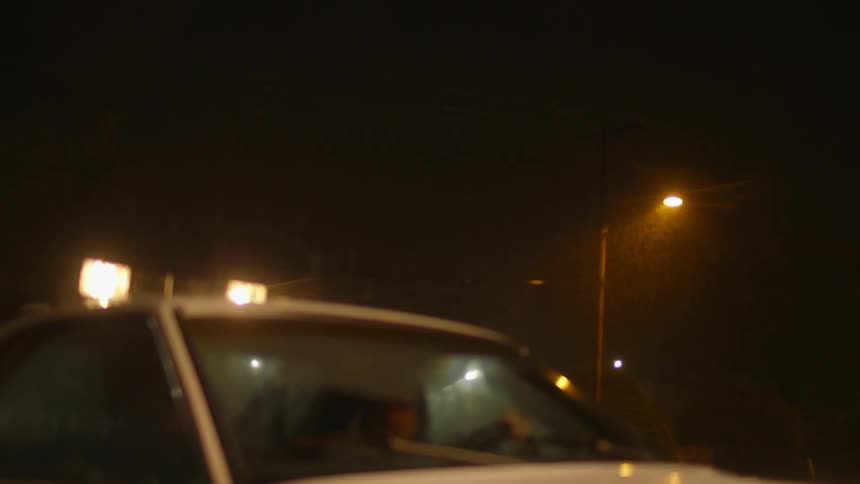 Truck outside in a thunderstorm at night