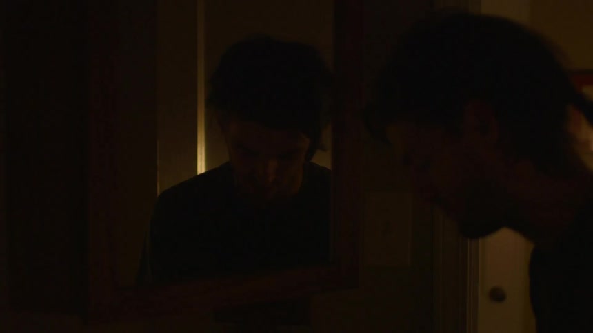 A man closes a bedroom door