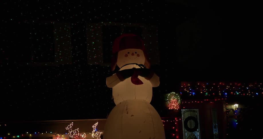 Outdoor christmas lights being filmed at night