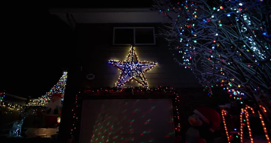 Holiday lights flash in the darkness