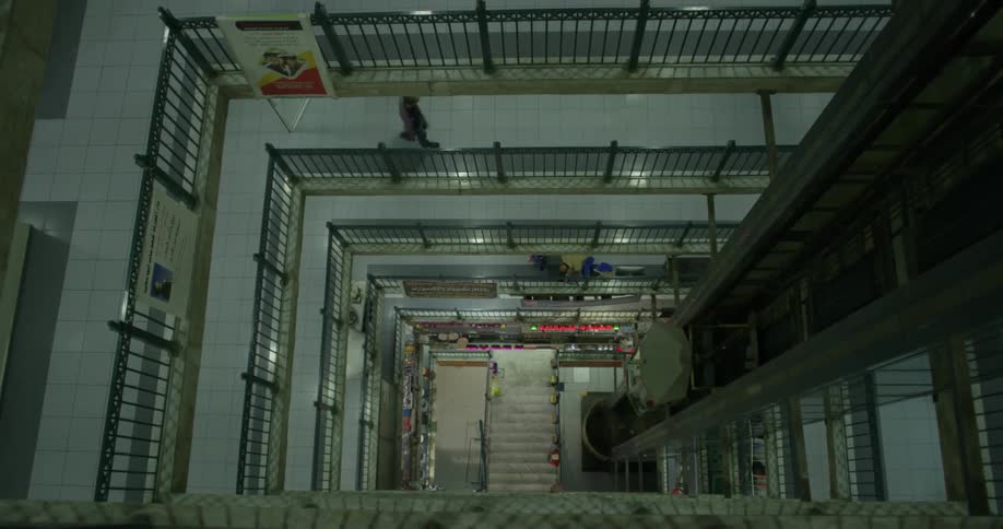 The elevator is going down past all the levels of this building
