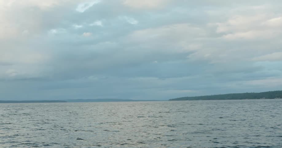 A large body of water on a cloudy day