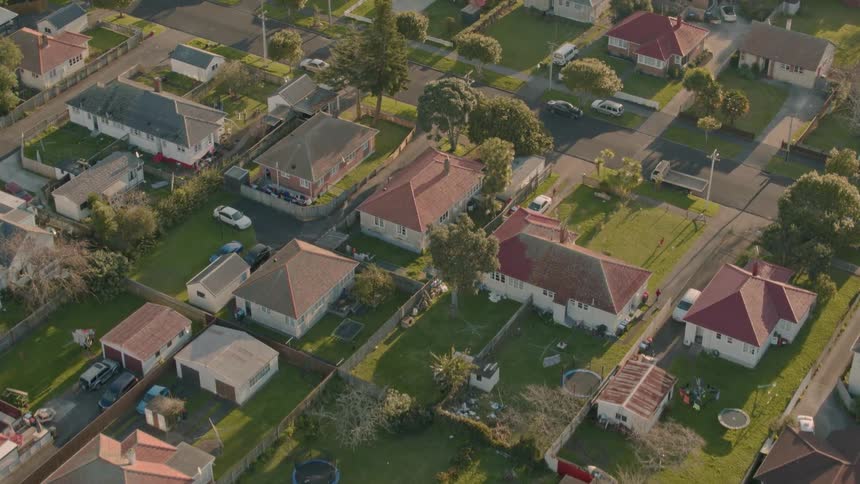 The sun is shining over the homes in this town