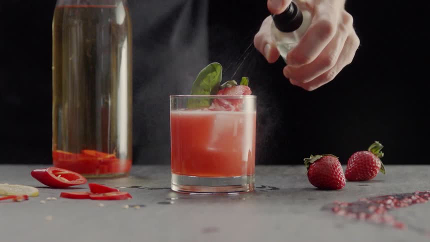 A drink is sprayed with a spray bottle
