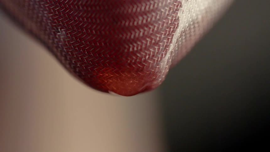 Fluid is strained through a screen