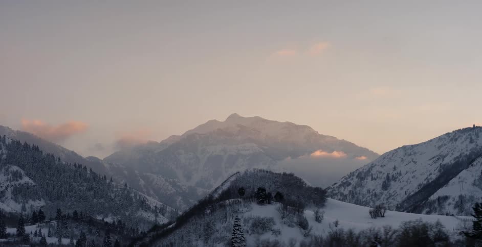 The mountain is high and covered with fog