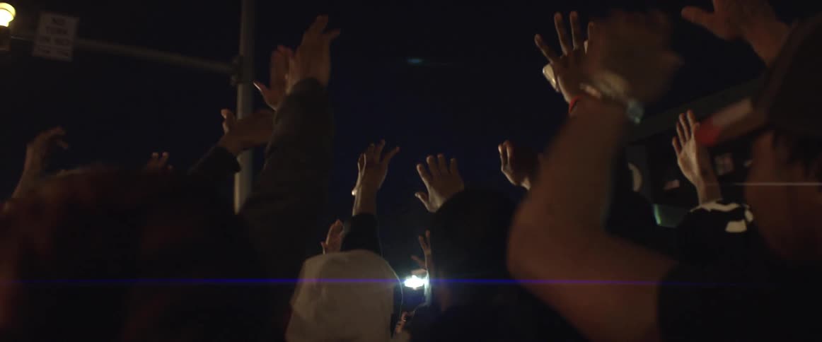 A group of protesters gather in the street and start protesting