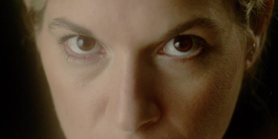 Woman opens her eyes and stares forward