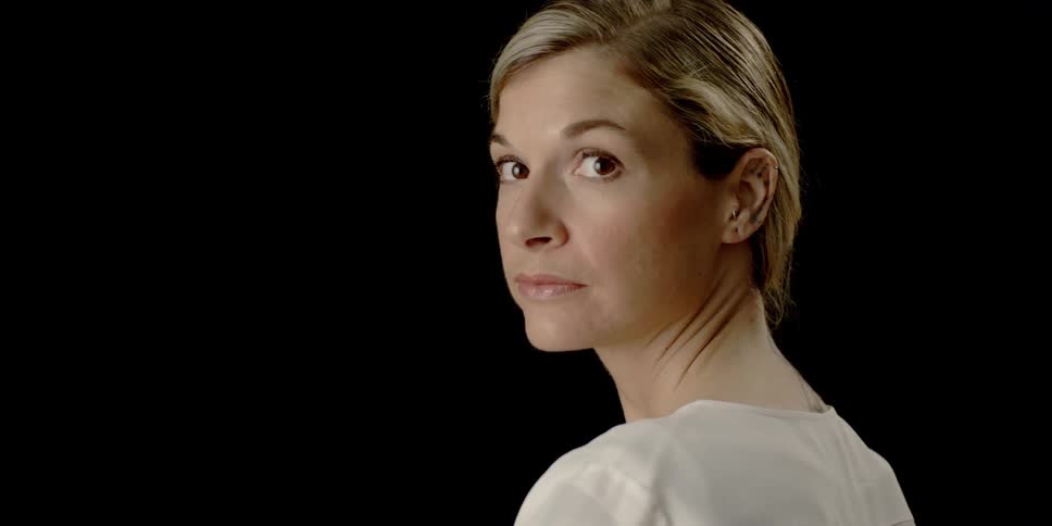 Woman looks back over her shoulder