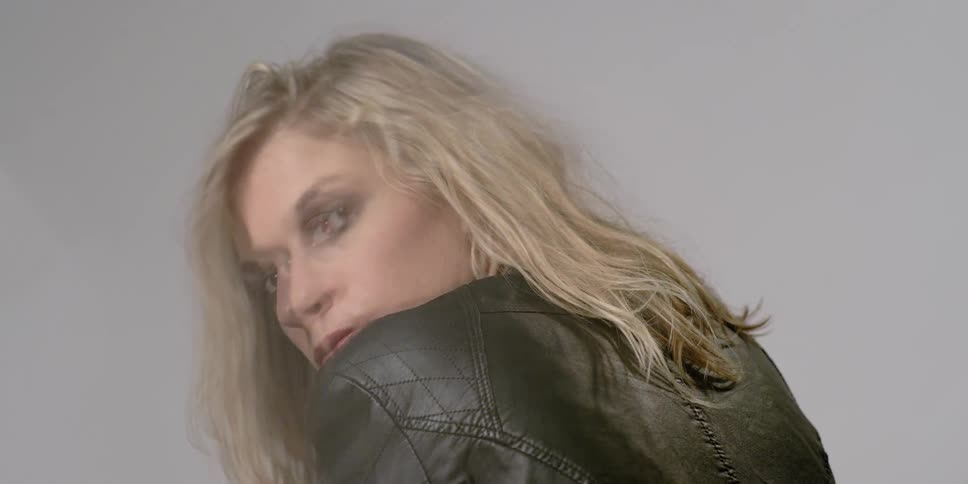 Woman looks back over her shoulder