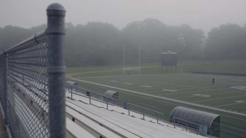 A fog covered football field