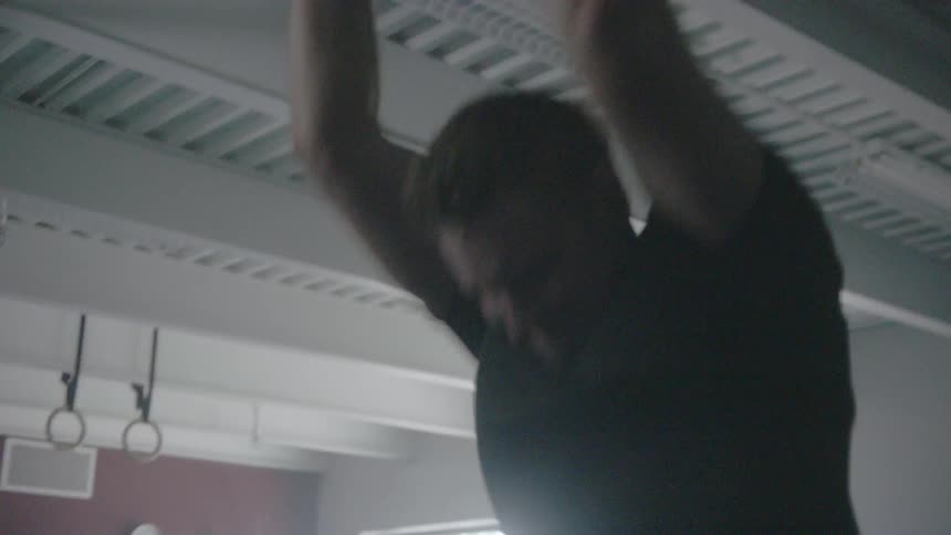 A man throws a heavy ball to the ground repeatedly