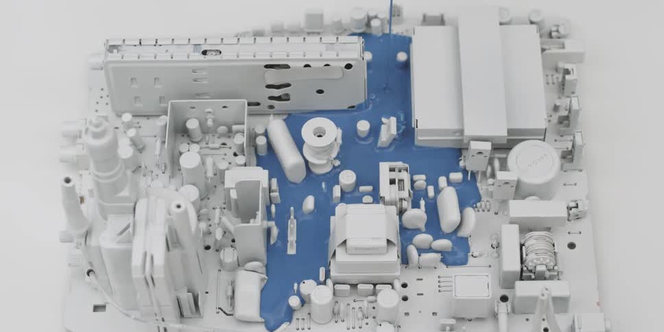 Blue liquid is poured onto a circuit board