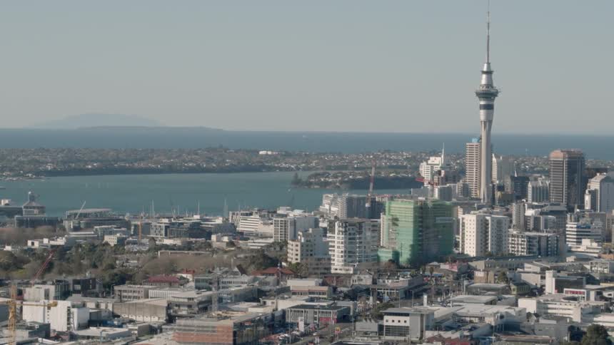 A large city is being filmed from the air
