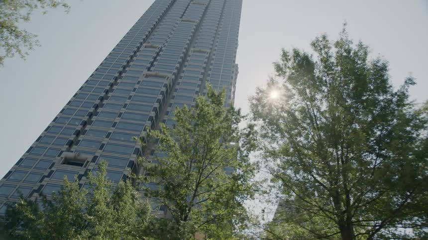 The building reaches up towards the sun in the sky