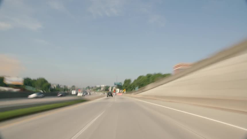 The cars speed down the winding highway