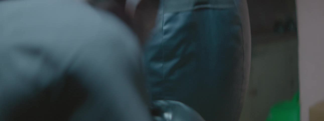 A man punches a punching bag