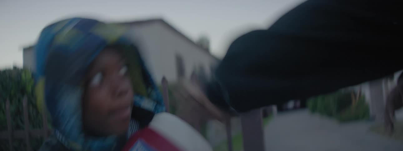 Man teaches boy to box in front yard