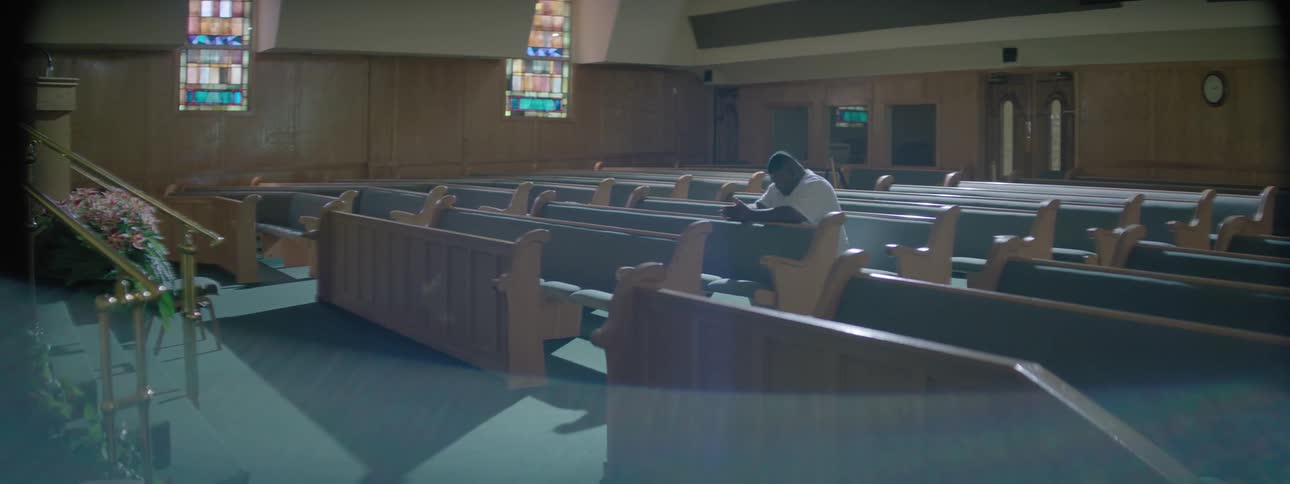 A man prays in a church