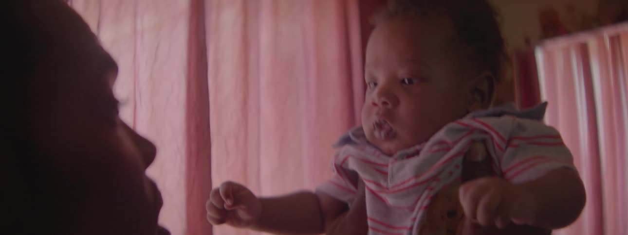A man bounces a baby