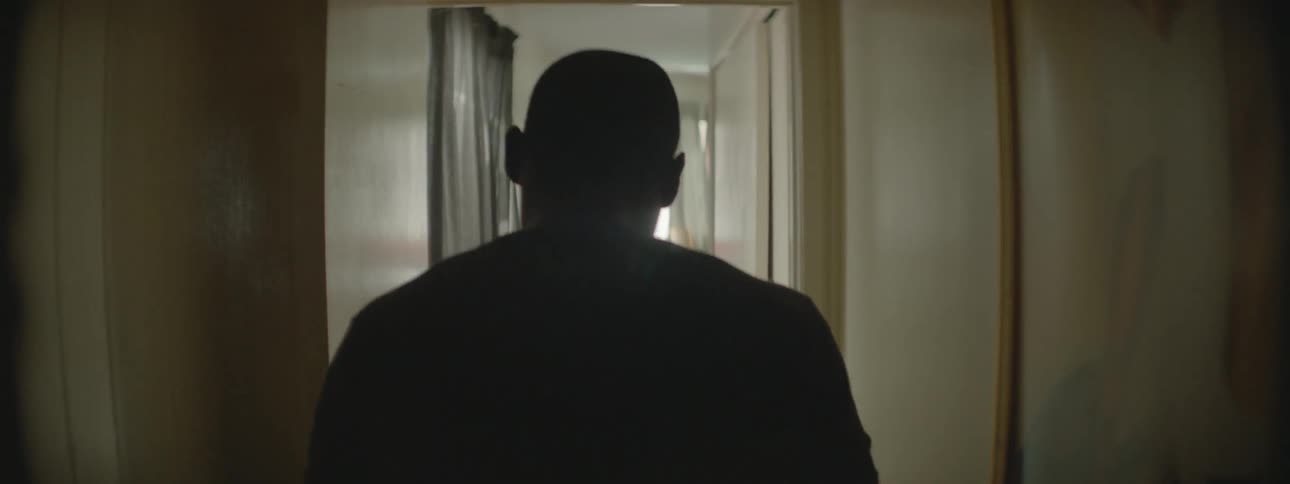 A man walking through a hallway in a house