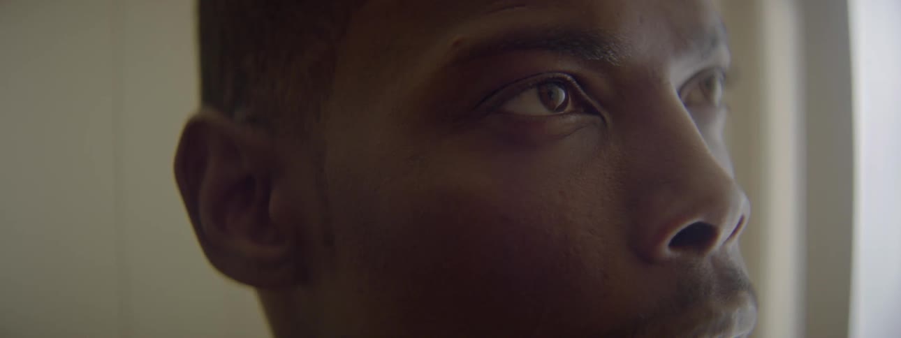 A man is staring up toward the ceiling