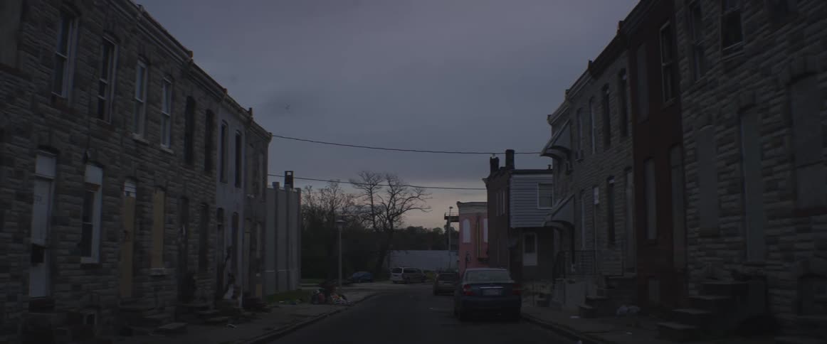 A person is walking down the street