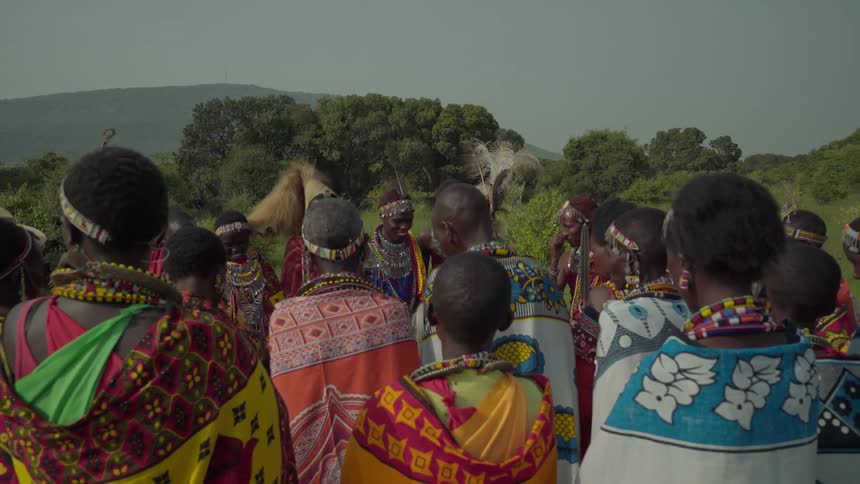 Group of maasai standing around talking
