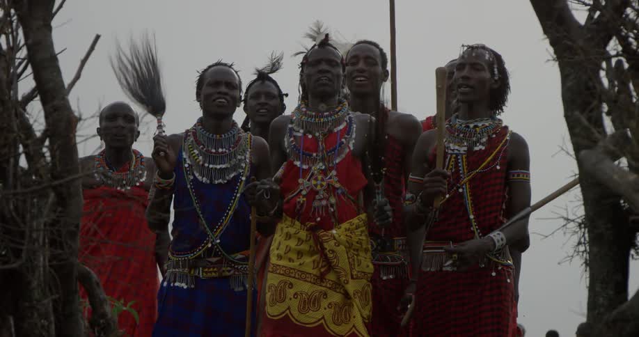 Maasai in costume dance together