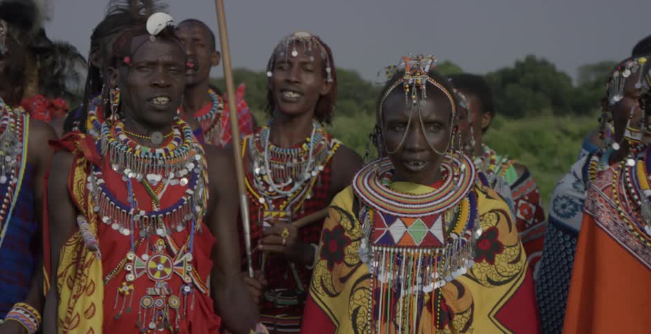 Maasai in costumes dance and sing