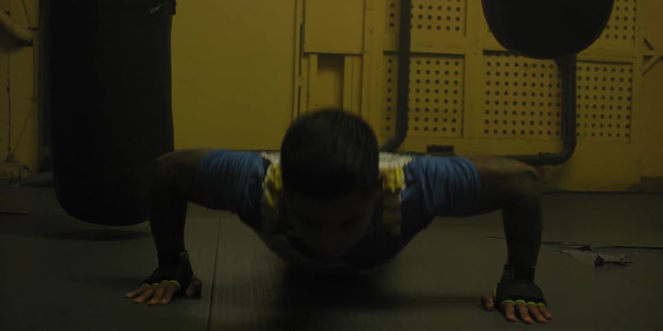 A man is doing push ups in the gym