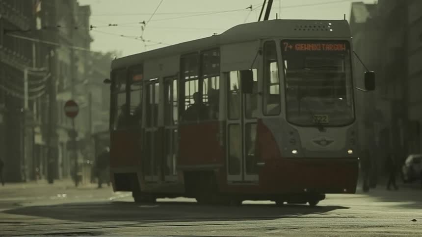 A streetcar in a busy urban setting