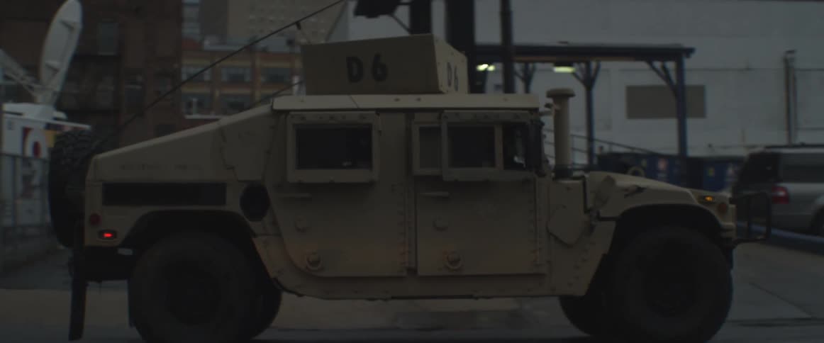 Large vehicle riding down a street