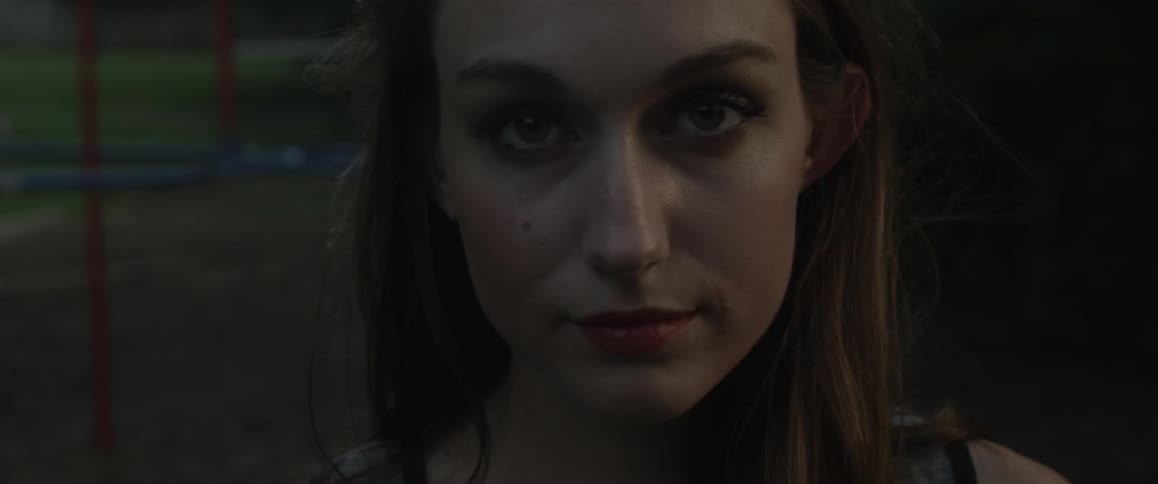 Woman looks forward and blinks