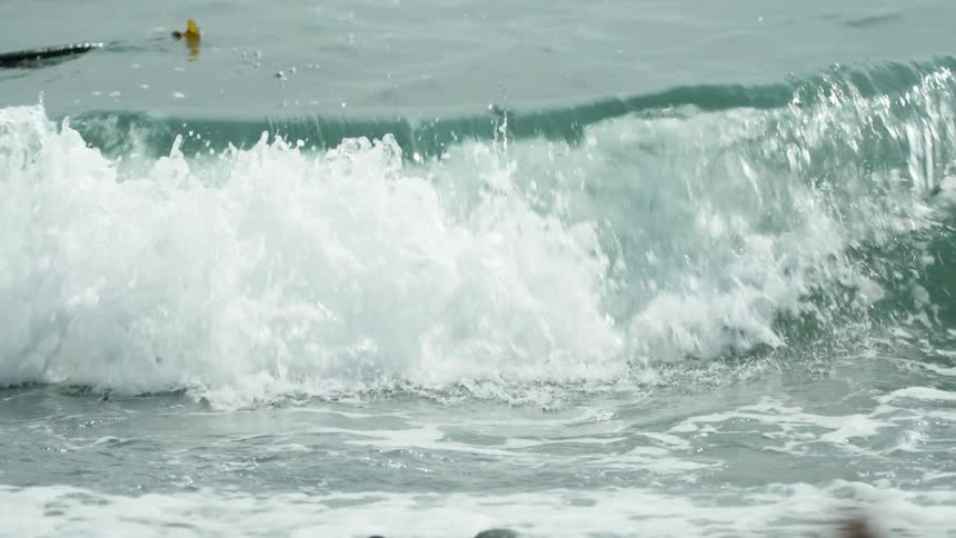 The large waves crash down ahead