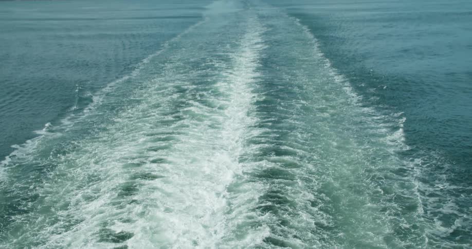 The boat is leaving waves as it travels in the water