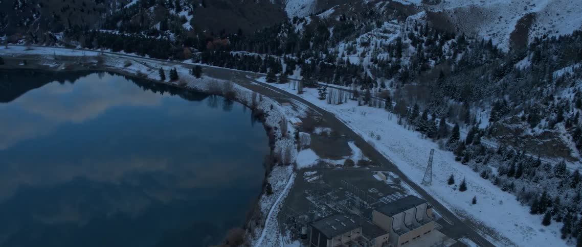 Snow covers the landscape in a mountain village