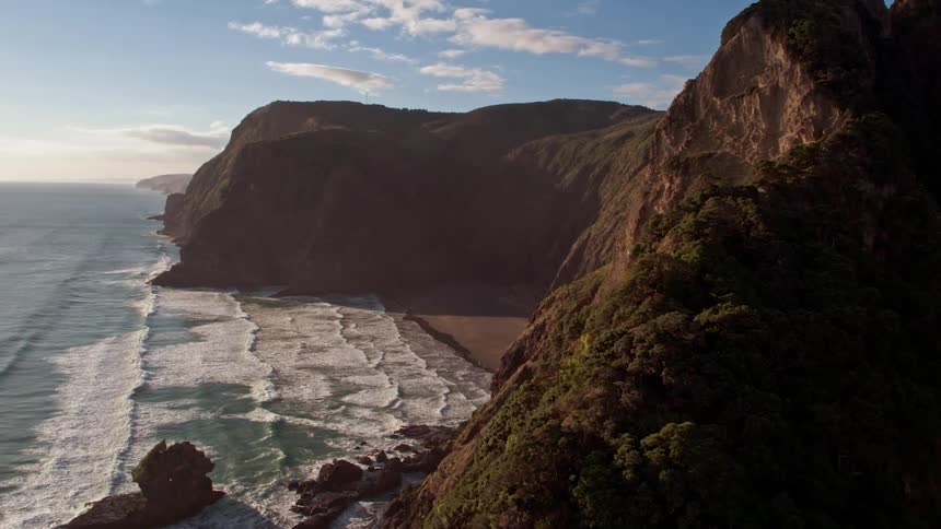Waves flow onto the beach shore