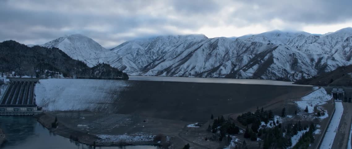 View of snowy mountains on a cloudy day
