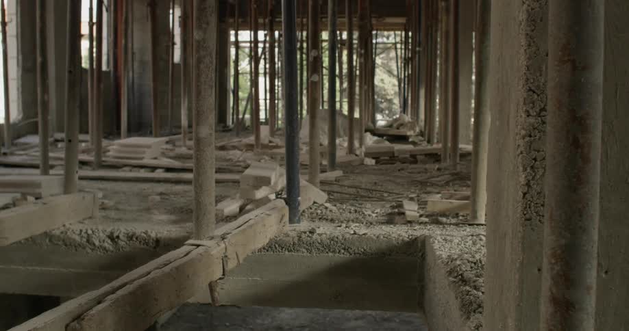 Beams and poles support the construction at a work site