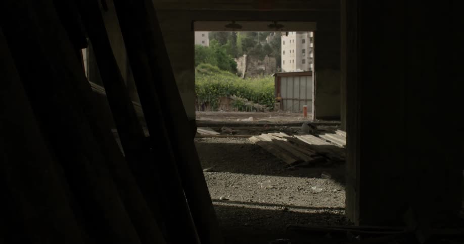 Debris lays next to an opening in the wall