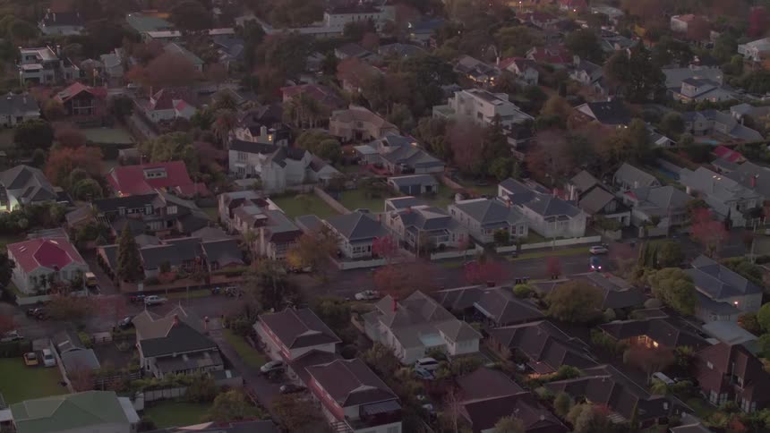 One car is driving down the road in this town
