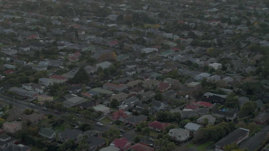 Houses cover the ground in a neighborhood